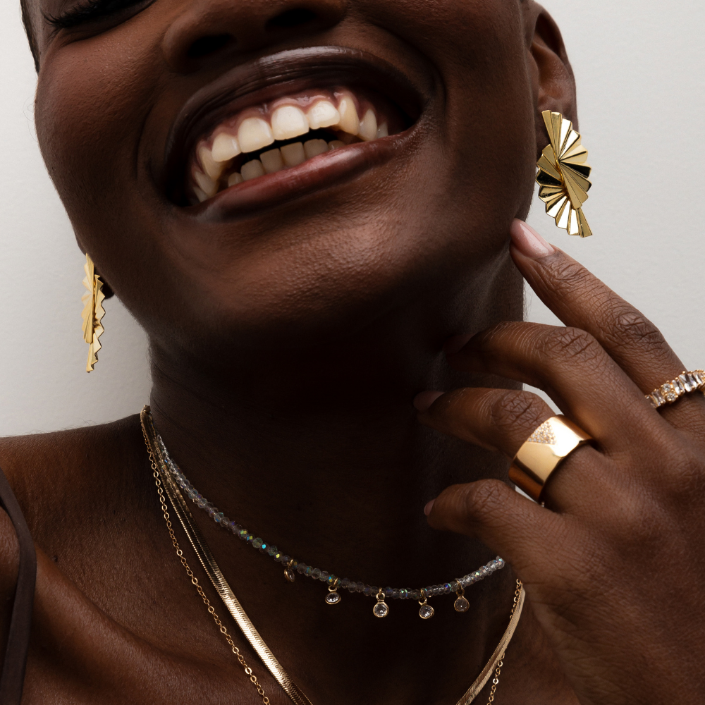 BRINCO LEQUE BANHO OURO 18K